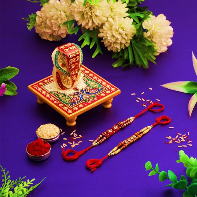 Rakshabandhan Set: Marble Chowki Ganesha, 2 Rakhi & Pack of Roli Chawal (rakhi1b)