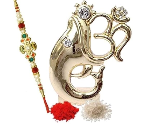 Traditional Rakhi for Brother: Ganesh Statute, Designer Rakhi & Auspicous Roli Chawal (rakhi62a) (Golden)