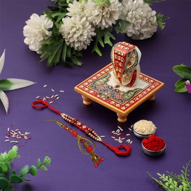 Rakhi Gift Set of 2 Designer Rakhis for Brother and Bhabhi with Chowki Ganesha and Pack of Roli Chawal (rakhi1c)